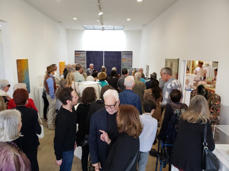 Local attendees appreciate and mingle at The Craft Center's Excellence in Fibers IV Exhibition. Craft in America