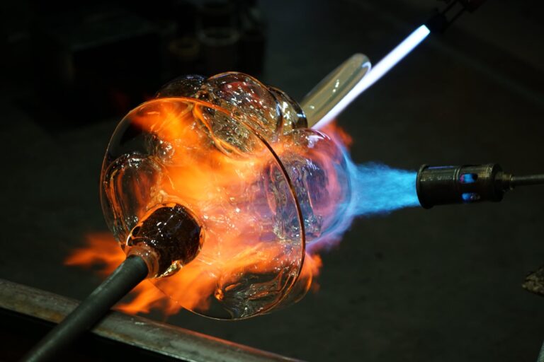 Glass heated under intense flames during a glassmaking demonstration in the Amphitheater Hot Shop. Courtesy of Corning Museum of Glass.