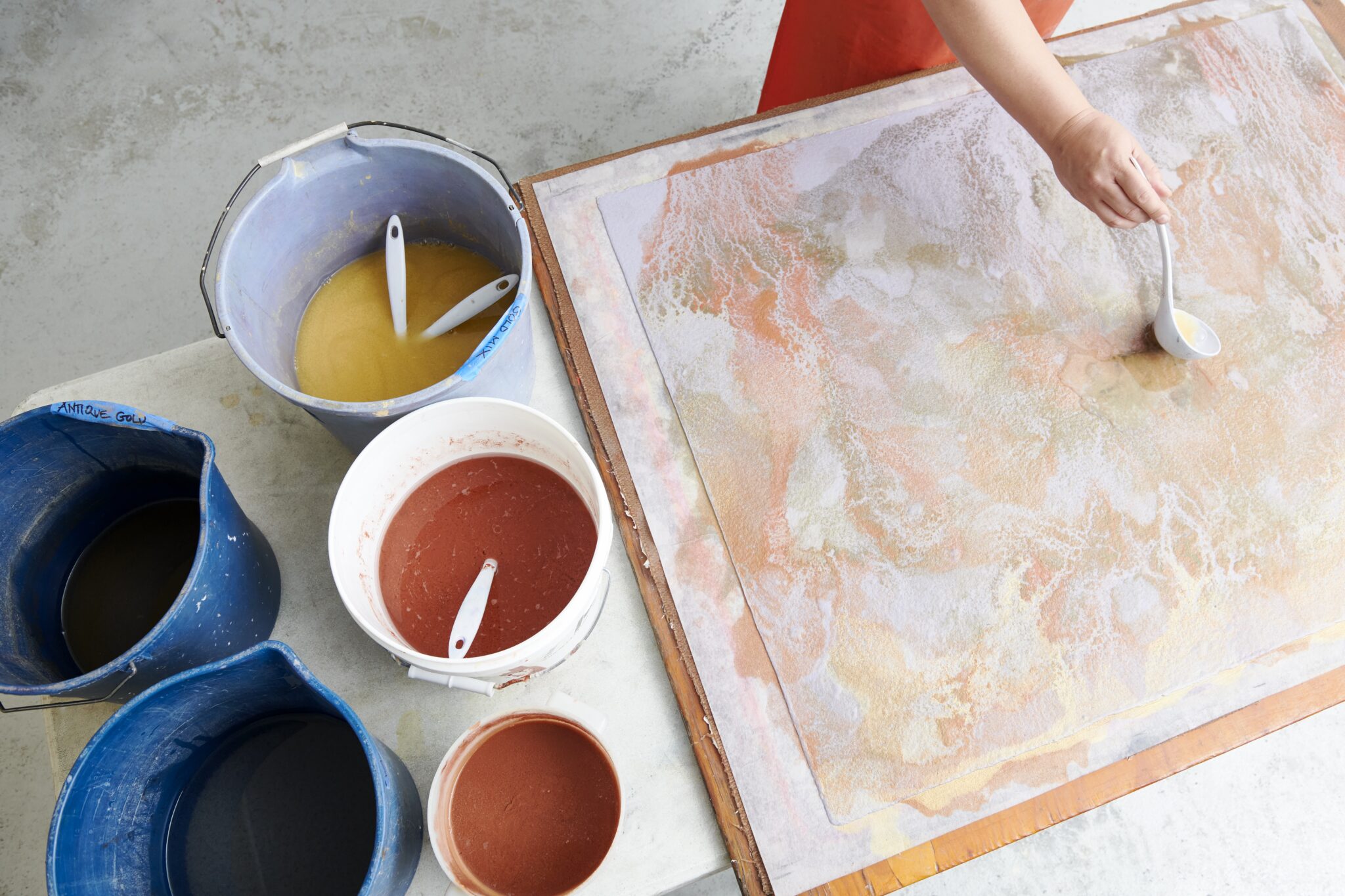 Artist Diana Al-Hadid creates background washes with pulp paint. Murray Hall