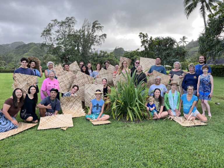 Keanahala weavers with completed moena wāwae (floor mats) at a retreat in Lāʻie, Oʻahu