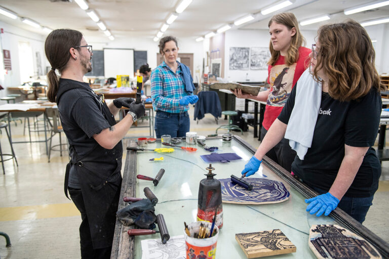 MSU’s Department of Art print studio in Briscoe Hall hosted a printmaking workshop led by Laurel-based printmaker Sean Star Wars. Star Wars brings his bold, multi-colored and self-named show—“Sean Star Wars: American Dream/Mississippi Nightmare—to MSU’s Visual Arts Center Gallery. Professor Jacob Crook helps guide the workshop participants. (photo by Megan Bean / © Mississippi State University)