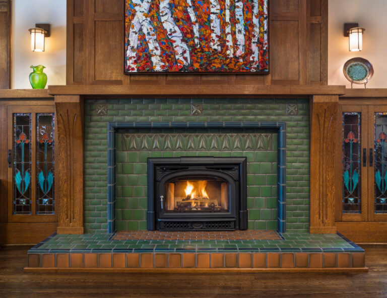 Arts and Crafts fireplace by Motawi Tileworks featuring Sullivan and Halsted relief tile and raised hearth. Justin Maconochie