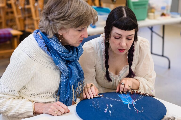 A student with Bobbin Lace Instructor, Elena Kanagy-loux at the John C. Campbell Folk School. Photo provided by John C. Campbell Folk School