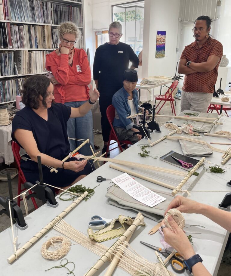 Local workshop attendees learn and practice backstrap weaving with exhibiting local artist Leslie Kice Nishigawara. Craft in America