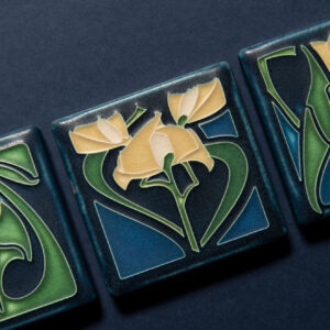 Arts and Crafts fireplace by Motawi Tileworks featuring Sullivan and Halsted relief tile and raised hearth. Justin Maconochie