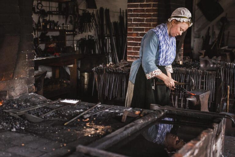 Journeywoman in the Anderson Blacksmith & Armoury in the Historic Area of Colonial Williamsburg. The Colonial Williamsburg Foundation