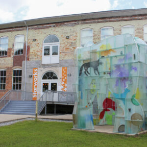 Therman Statom's Glass House Sculpture stands out front of the School House Gallery at Starworks. Claire Sellers