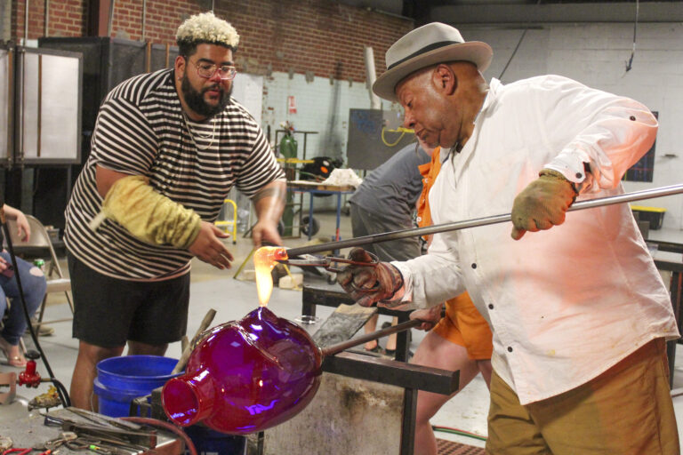 Resident glass artist Corey Pemberton and board member Therman Statom at Starworks Glass Studio. Claire Sellers