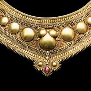 HINGED GOLD GORGET from Kerala, India, of high karat gold and ruby, early 19th Century. Photograph by Robert K. Liu/Ornament