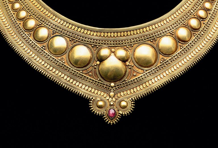 HINGED GOLD GORGET from Kerala, India, of high karat gold and ruby, early 19th Century. Photograph by Robert K. Liu/Ornament