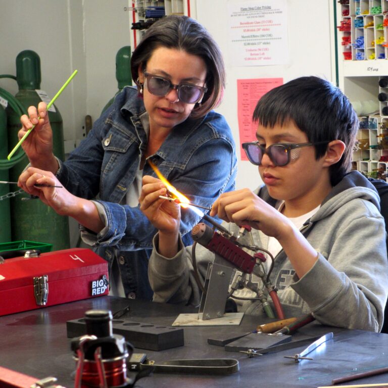 Mother and son in flame shop class. SGS image