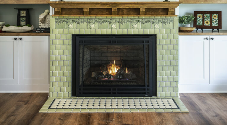 Ivy tile fireplace by Motawi Tileworks featuring Flora art tile. Justin Maconochie