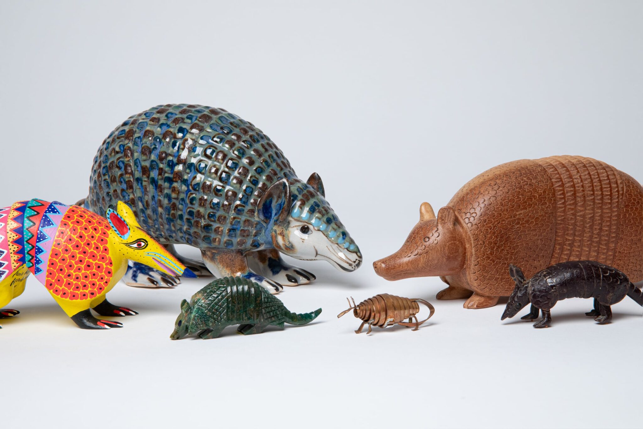 Tuck and Roll: The Art of Armadillos, On View: May 24, 2025 - Jan 11, 2026, curated by Guusje Sanders. This installation brings fun to our Entry Level cases by showcasing armadillo figures from Mingei’s permanent collection! Featuring works made by artisans across the Americas, this playful installation emphasizes how these extraordinary creatures have delighted people’s imagination. It is free to the public in the "community level" of the museum. Six armadillos in a variety of colors and materials from Mexico, Brazil, the United States of America, and El Salvador. 1999-11-004, 1993-55-132, 1993-55-172A, 1993-55-146, 1993-55-143, 1993-55-066.