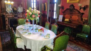 The Lippitt House Dining Room has been described as one of the best surviving example of mid-nineteenth century dining iconography in America. It epitomizes the 19th century Victorian aesthetic with highly decorated, over-scale furniture featuring hunt and harvest imagery, which is also depicted in carved architectural details and in the still lifes hung in the room. Courtesy of Lippitt House Museum