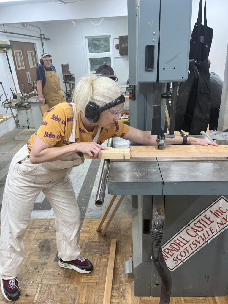 Student bandsawing stock. Ken Page