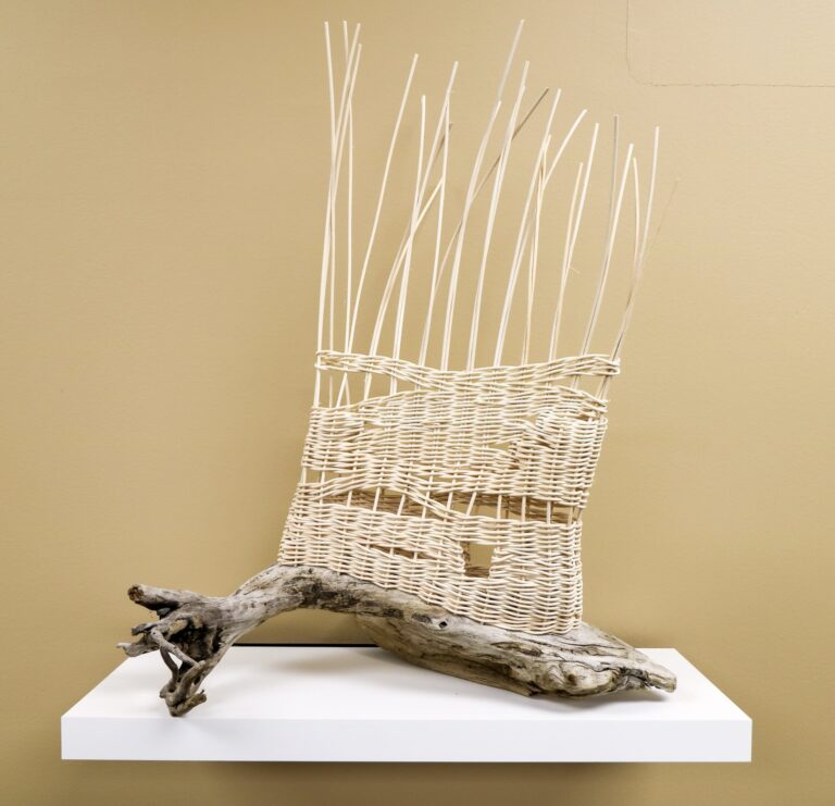 "River’s Edge" by Shannon Lucas Westrum, 2023, Rattan, Lake Superior driftwood Stake and strand “pillow’ construction, twining, single weave, unfinished edge. Photo credit: Shannon Lucas Westrum