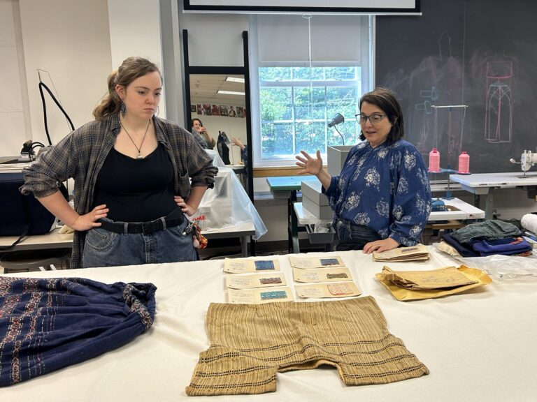 Sophia Gupman and Kelly Cobb examining Letty’s textiles at the University of Delaware textiles lab. Wharton Esherick Museum.
