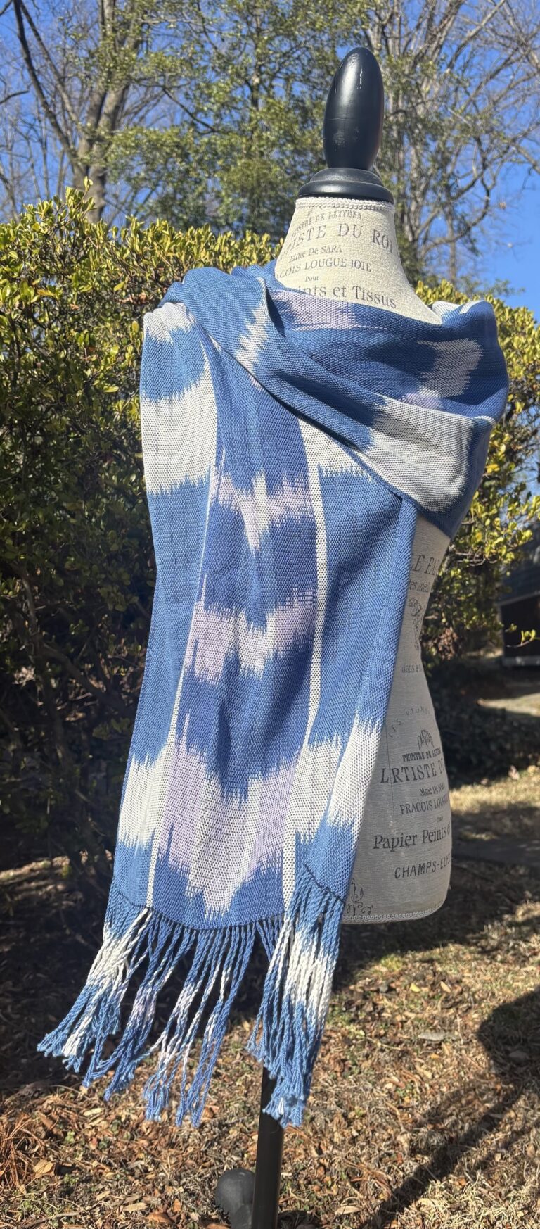 Summer Sky by hope Anderson. This piece is a hand-dyed Ikat warp on ecru and lilac cottolin with indigo silk weft. Hope Anderson