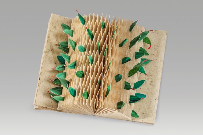 Artist Book by Aimee Lee. Aimee Lee, Unity (Version 4), 2024, acrylic on paper, pen on milkweed bast hanji, 8.75″ x 5.1″ x 1.75” closed, 11” wide open. Courtesy of the artist. Artist Book by Aimee Lee. Aimee Lee, Unity (Version 4), 2024, acrylic on paper, pen on milkweed bast hanji, 8.75" x 5.1" x 1.75” closed, 11” wide open. Courtesy of the artist.