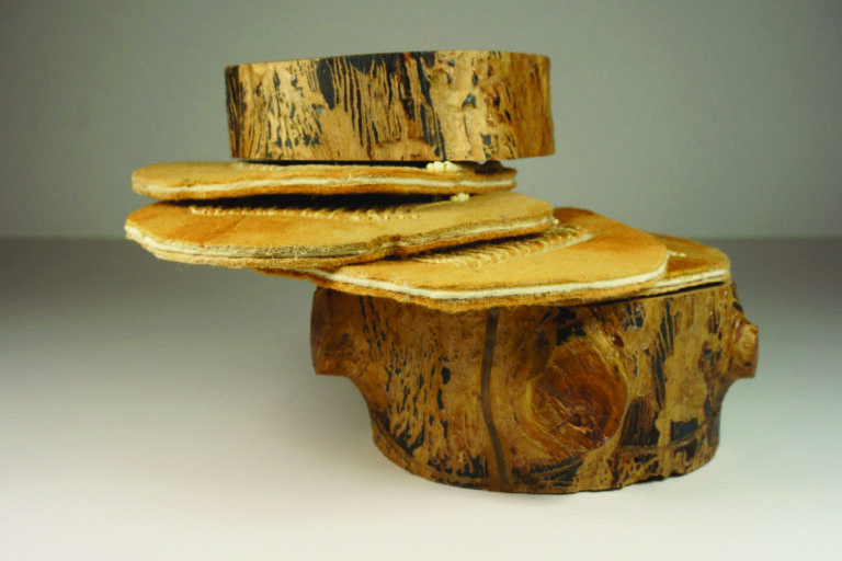 Suze Woolf (Seattle, WA), Scotylid Lifecycle, 2019. Insect galleries on fir log, iron oxide-dyed wood felt, embroidery thread, beads, tarnished brass grommets and binding post, 5”h x 6”dia., unique Suze Woolf (Seattle, WA), Scotylid Lifecycle, 2019. Insect galleries on fir log, iron oxide-dyed wood felt, embroidery thread, beads, tarnished brass grommets and binding post, 5”h x 6”dia., unique, photo supplied by artist.