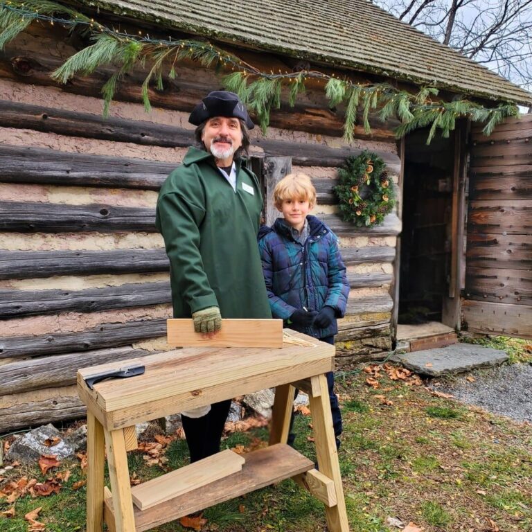 Colonial Interpretation in front of the Log Cabin. Red Mill Museum Village Colonial Interpretation in front of the Log Cabin. Red Mill Museum Village