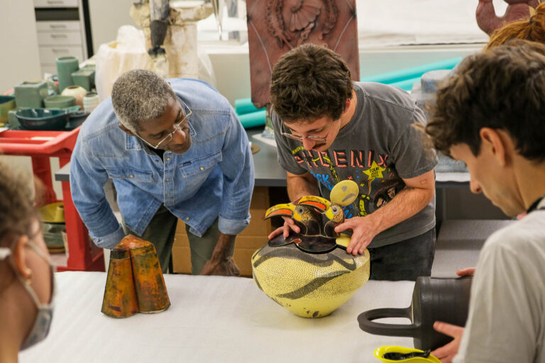 Students and faculty discussing work from the collection. Brian Oglesbee