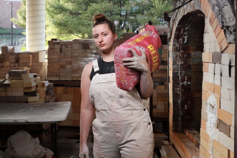 Like all of our students Elena '24 found herself doing more than just creating beautiful objects within Student Craft. Students here are involved in every aspect of the process from repairing equipment to designing new products. Elena is shown here working hard preparing to mix clay for new work. Sean Hall '25