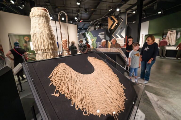 Visitors in the special exhibition Woven in Wool: Resilience in Coast Salish Weaving at the Burke Museum of Natural History and Culture. Chris Snyder/Burke Museum