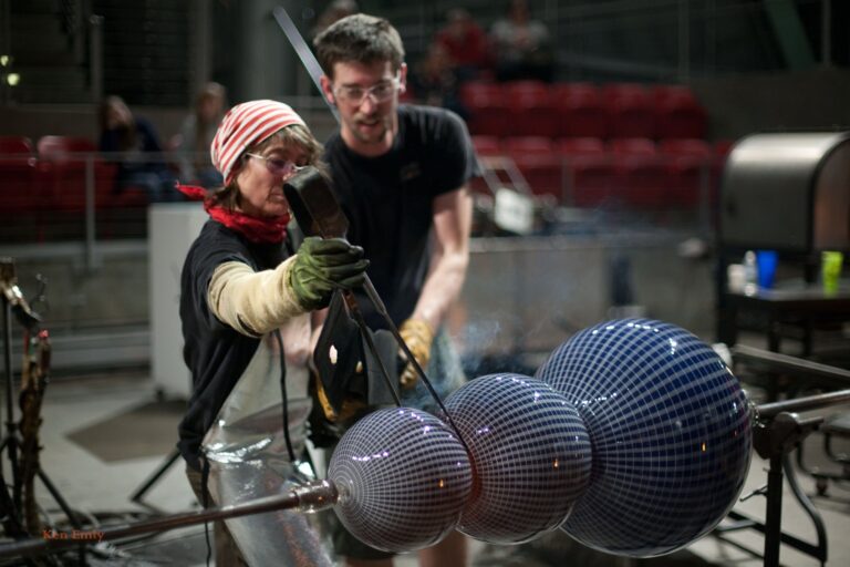Visiting Artist Nancy Callan hot-sculpts a snowman in the Hot Shop. Photo by Ken Emly