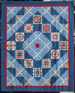 2026 Raffle Quilt, “Every Quilt Tells a Story". Michelle Lisa Giorla