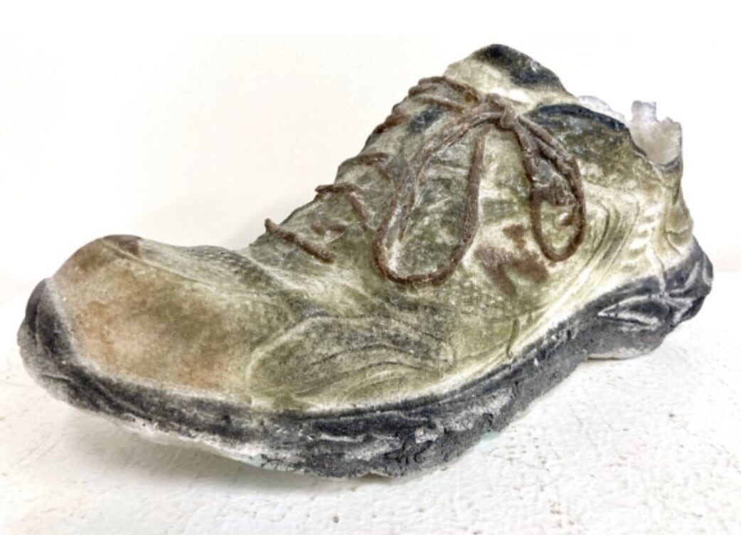 Image of a cast paté de verre shoe by Dori Settles. Image courtesy of Dori Settles