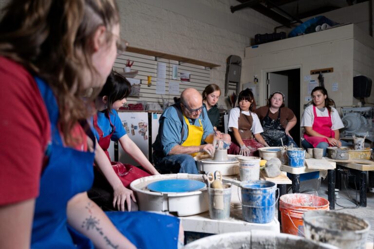 In addition to creating crafted objects Student Craft also teaches about craft in schools throughout Appalachia. In this photo Director of Outreach Steve Davis-Rosenbaum teaches students ceramics techniques that tie craft to the standardized public school curriculum. Justin Skeens