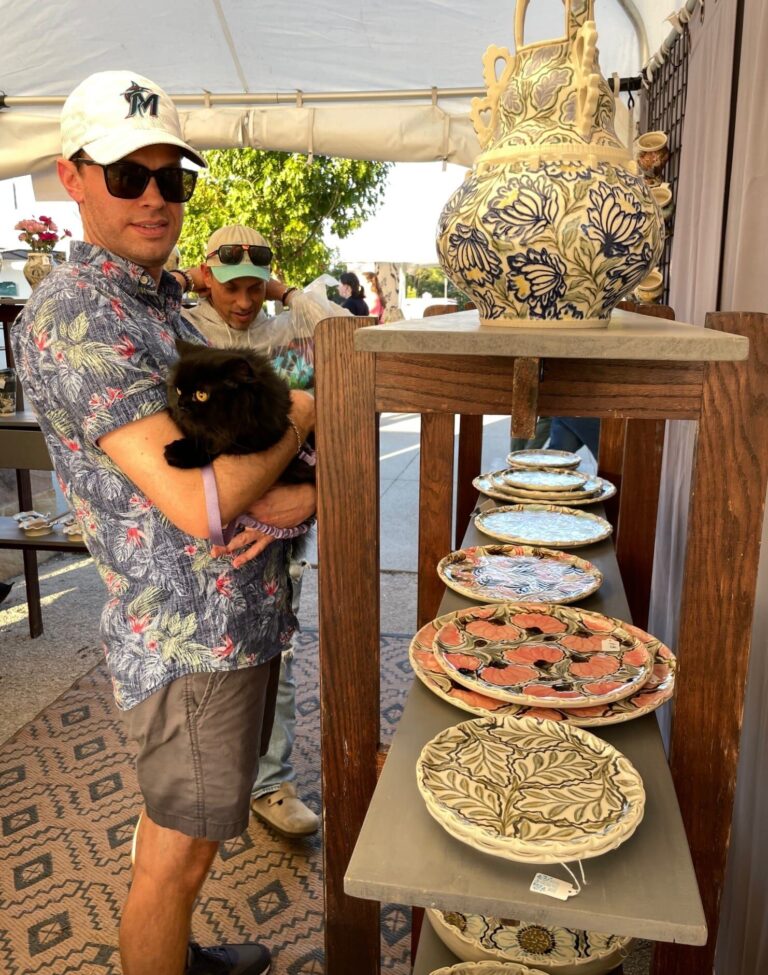 Audry Deal-McEver's booth of hand made and decorated ceramics attracts all sorts of visitors. Audry Deal-McEver