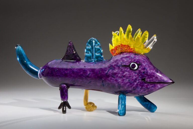 Mixed up flamy! Designed by Andrea Garcia (age 10), made by Museum of Glass Hot Shop Team. Mixed up flamy!, 2007. Blown and hot-sculpted glass with applied bits; 10 1/2 x 22 x 5 inches. Collection of Museum of Glass in partnership with Mary Bridge Children's Hospital, Tacoma, Washington. Sponsored by Mikal and Lynn Thomsen. Photo by Russell Johnson and Jeff Curtis.