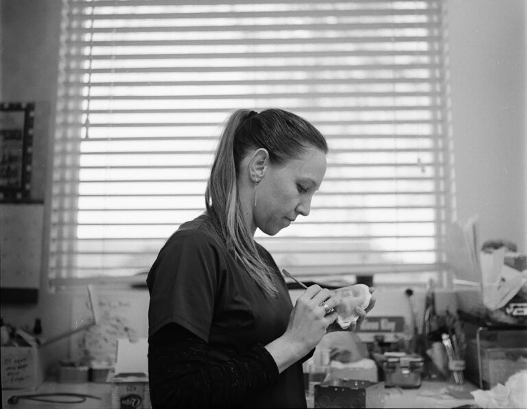 Anaplastologist Chelsea Lillo sculpting a prosthesis in her lab. Lyndon House Arts Center