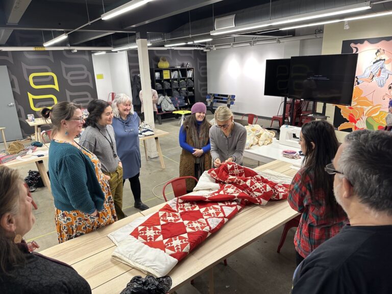 Amy Meissner demonstrates quilt repair. Anchorage Museum