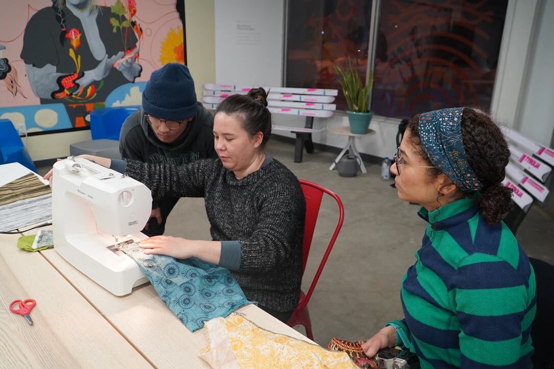 Jamie Hirano instructs workshops attendees. Anchorage Museum