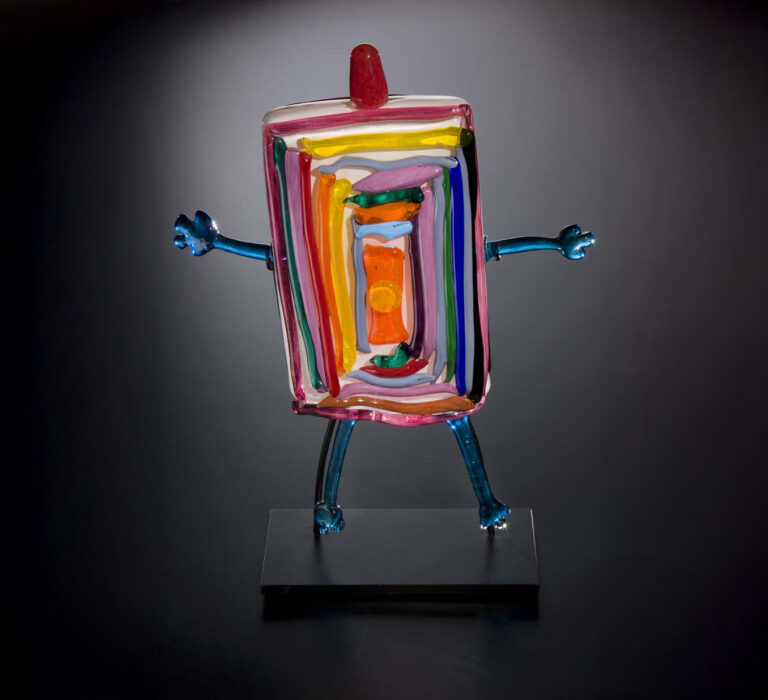 Bob the Box Head. Designed by Ashley Teifke (age 5), made by Museum of Glass Hot Shop Team. Bob the Box Head, 20008. Blown and hot-sculpted glass with applied bits; 19 x 15 x 3 3/8 inches. Collection of Museum of Glass, Tacoma, Washington. Sponsored by Click! Cable TV. Photo by Russell Johnson and Jeff Curtis.