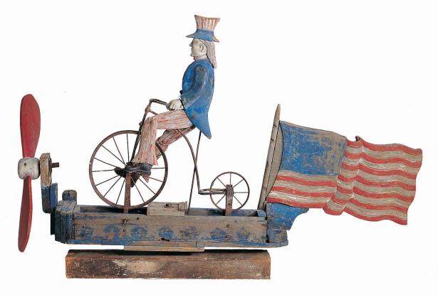 "Uncle Sam Riding a Bicycle Whirligig," Probably New York State, 1880 – 1920, paint on wood with metal, 37 x 55 1/2 x 11 in., Gift of Dorothea and Leo Rabkin , 2008.6.1, American Folk Art Museum