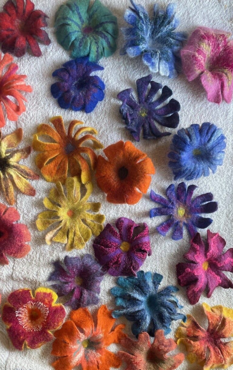 Wet felted flowers of different colors. American Swedish Institute