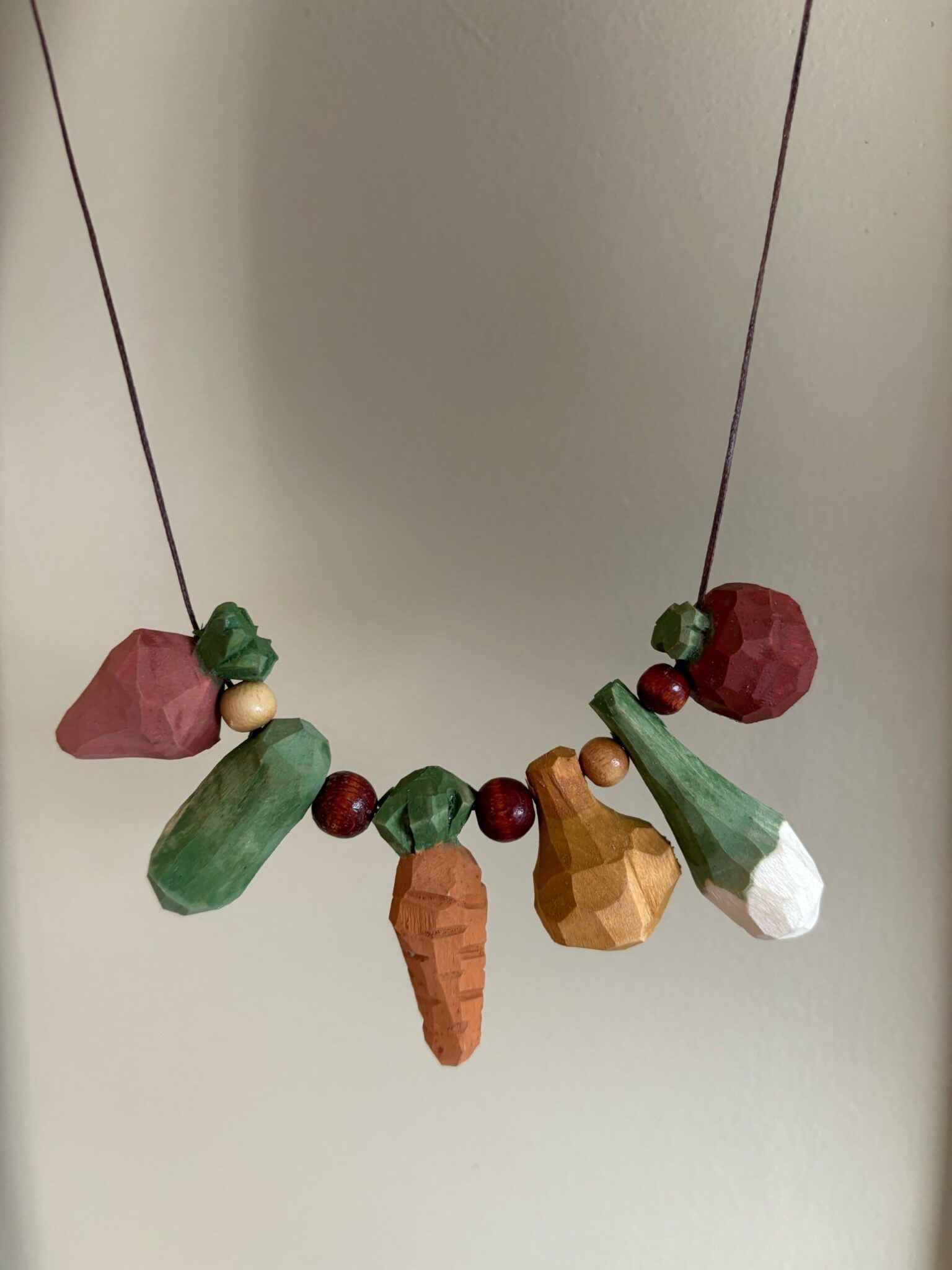 Carved veggies on a string. American Swedish Institute