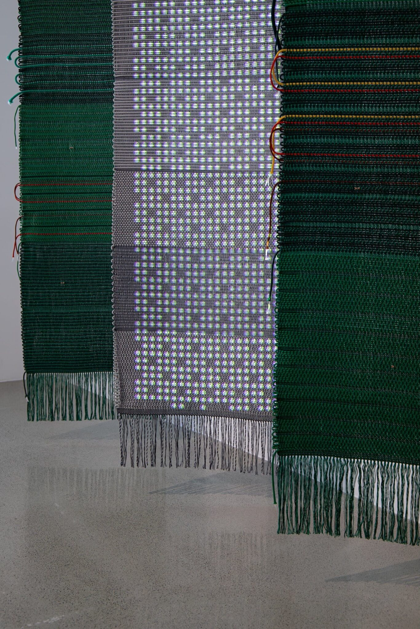 Ahree Lee, Binary System, 2022. Nylon and cotton weaving with digital projection, 72 x 70 x 30 inches. Photo: Tatiana Mata. Courtesy of the artist.