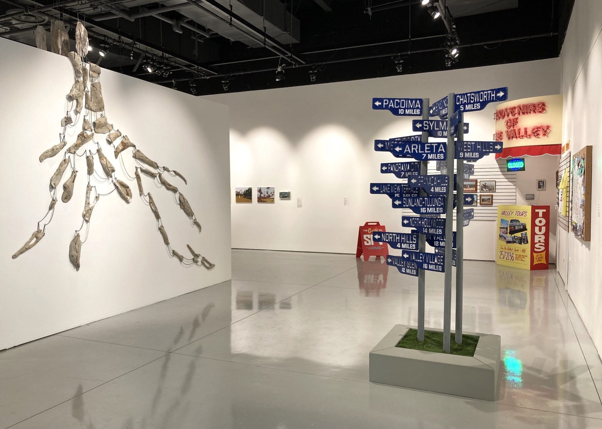 An installation view of the exhibition The Journey is the Destination: Recording Los Angeles featuring the works of artists Debra Scacco, Fía Benitez, and Vincent Enrique Hernandez (from left to right). The exhibition was curated by Holly Jerger. The Journey is the Destination: Recording Los Angeles installation view, 2025. Photo: Oscar Jimenez. Courtesy of CSUN Art Galleries.