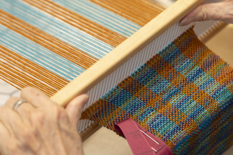 Jan weaving on a rigid heddle loom. Max Woltman