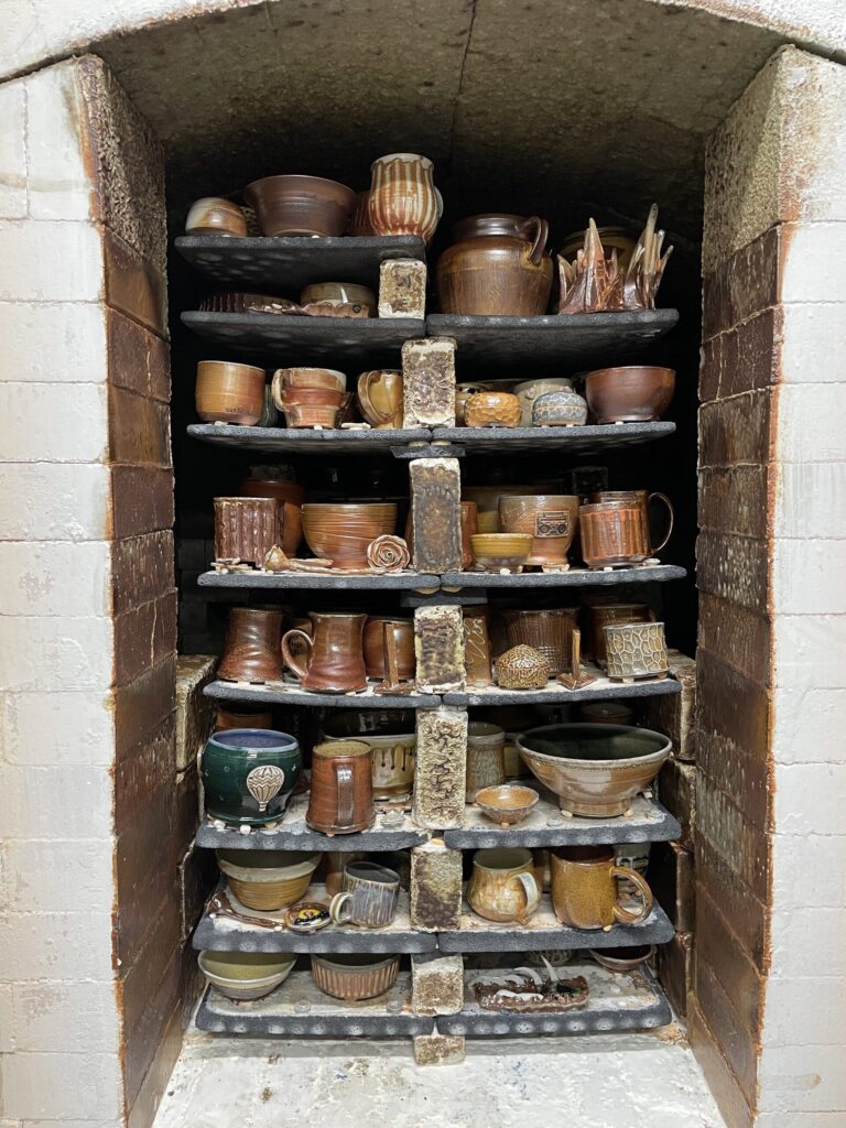 A full kiln ready to be unloaded in Northern Clay Center's studio space