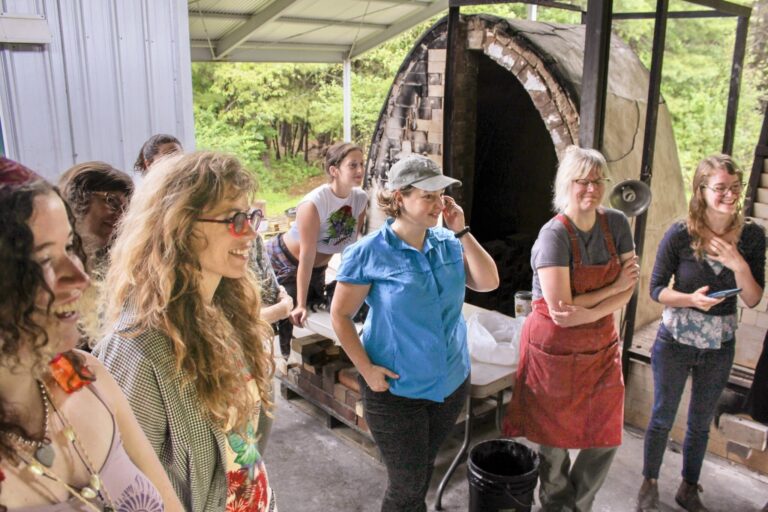 A group of summer residents gather on the kiln pad. Georgia Howe