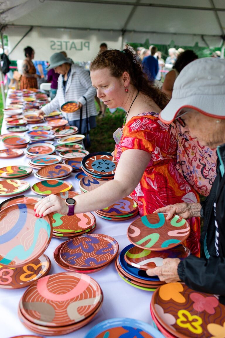 Attendee choosing their plate at 2025 Salad Days. Lindsay Heald Becker