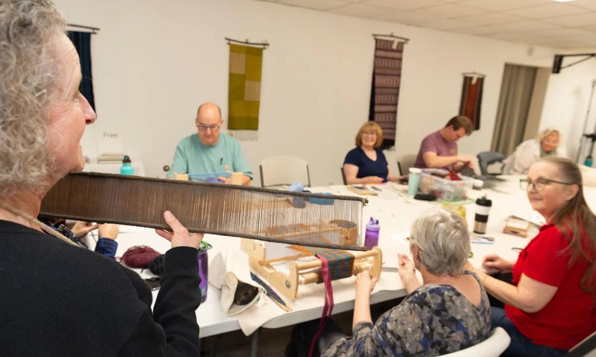 Ruth demonstrates during an open weaving session. Max Woltman