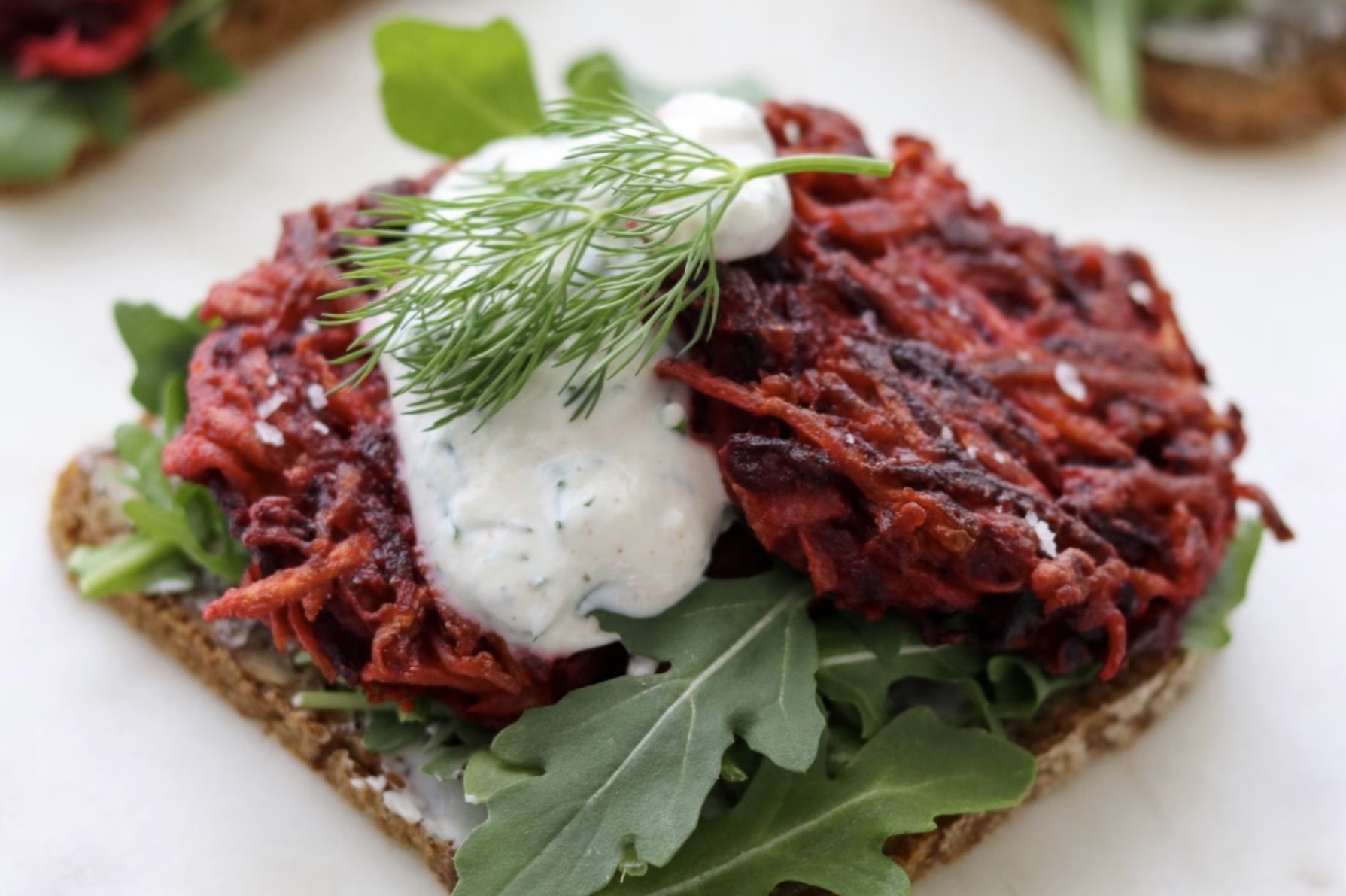 Open faced beet sandwich with dill and arugula. American Swedish Institute