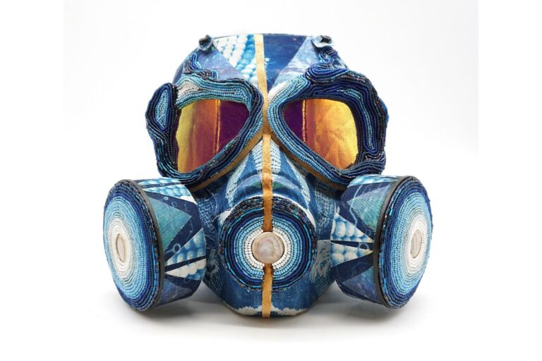 Mona Cliff, "Past/presence/future lV," 2026. Gas mask, beeswax, leather, seedbeads, fabric; 8 x 10 x 5 in. Image by Belger Arts.